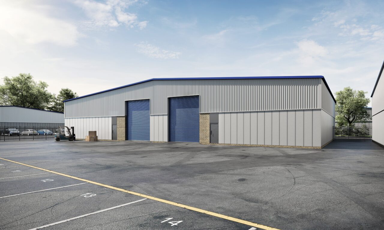 A large industrial warehouse with two blue roller doors, surrounded by an empty paved lot marked with numbered parking spaces.