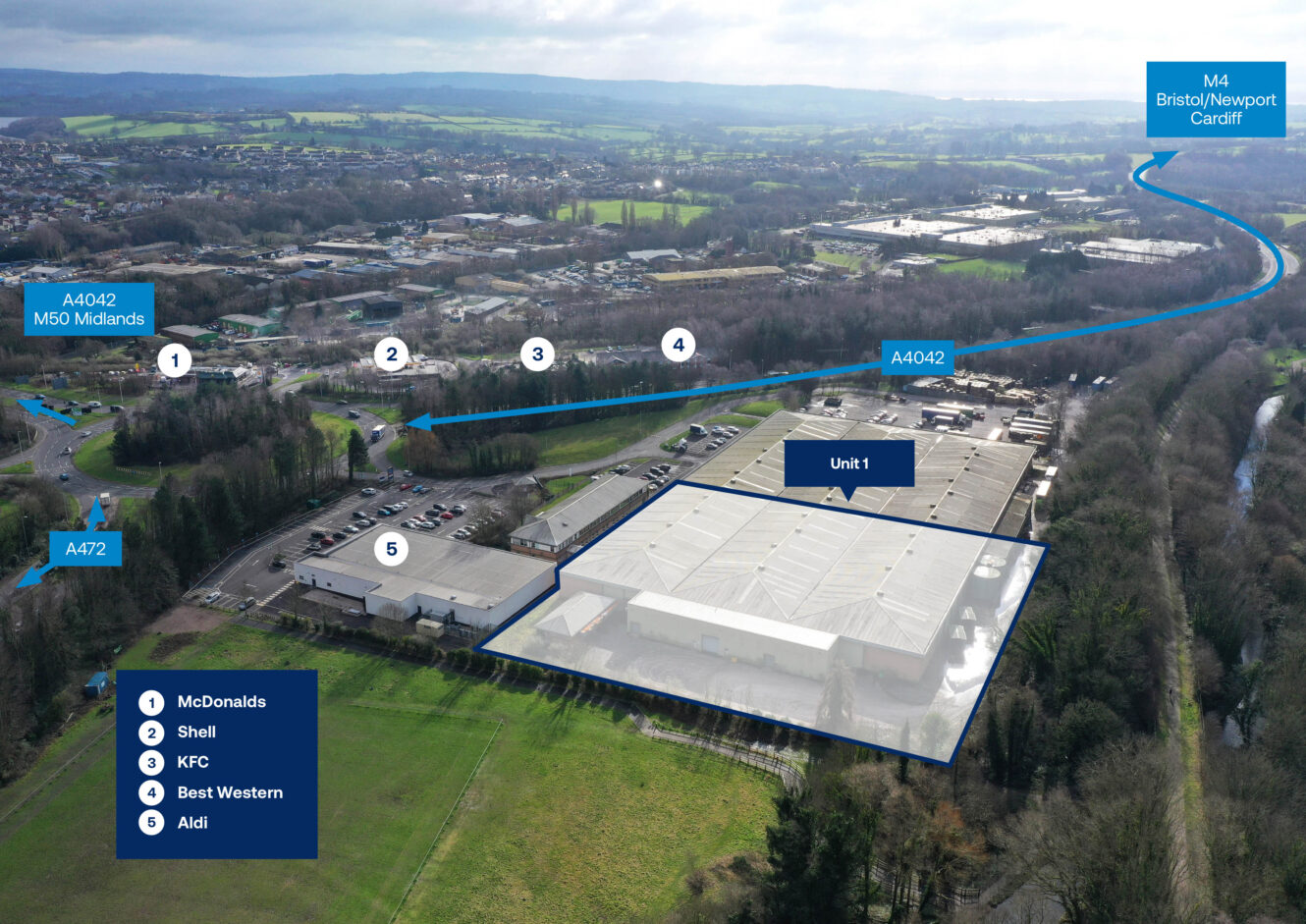 Aerial view of a business park with Unit 1 highlighted, nearby roads labeled, and five businesses marked: McDonalds, Shell, KFC, Best Western, and Aldi.