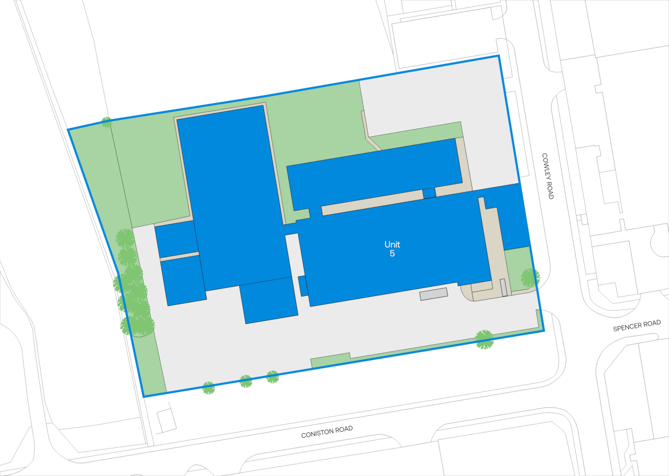Site plan showing building layouts outlined in blue, labeled Unit 5, with surrounding roads: Corston Road, Charles Road, and Spencer Road. Green areas indicate landscaping.