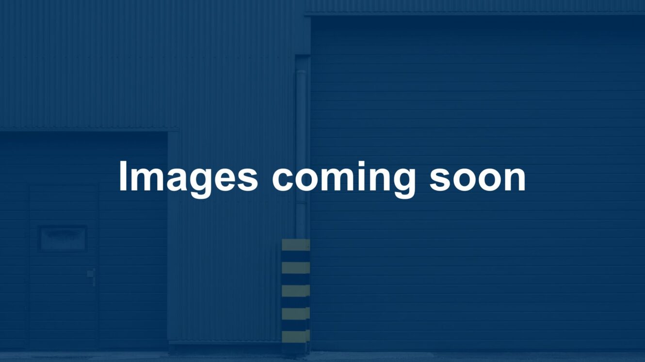 A blue background with the words Images coming soon in white text is centered over a building with two closed garage doors.