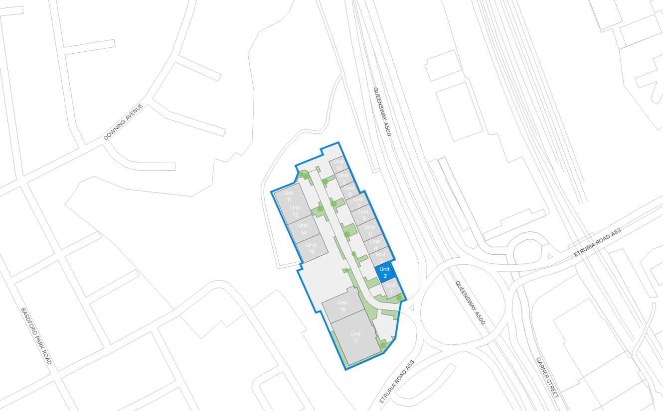 Site plan map showing outlined property with labelled units, adjacent roads, a roundabout, and surrounding street layout in greyscale.