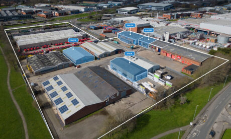 Aerial view of an industrial estate with multiple warehouse units, some labelled as Unit B, Unit 2A, and Unit 2B, enclosed by a white boundary line.
