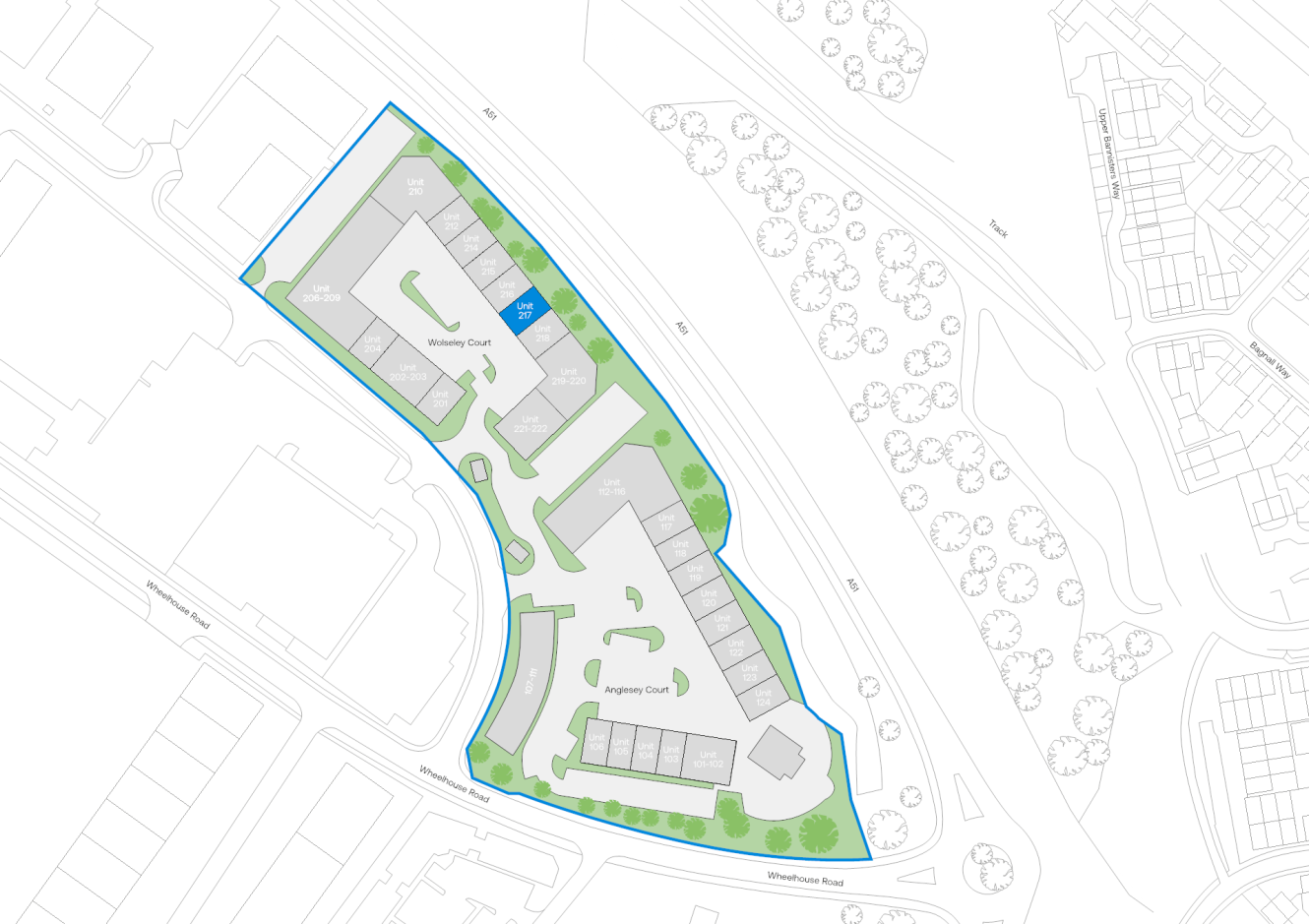 Site plan showing outlined property boundary, buildings, green landscaped zones, paths, parking areas, adjacent roads, and trees.