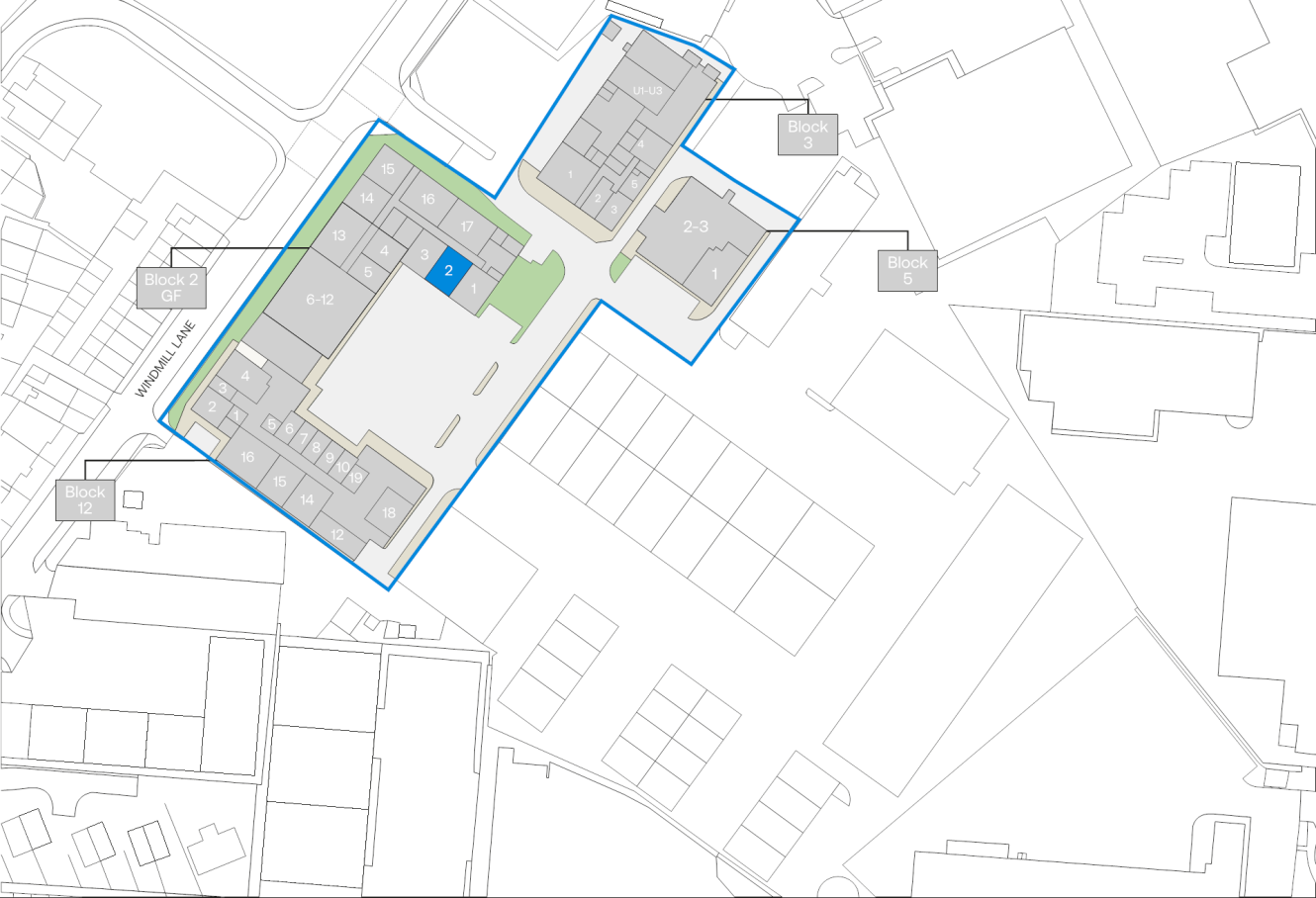 Site map with numbered and block-labelled buildings, pathways, parking areas, and nearby structures in a campus-like layout.