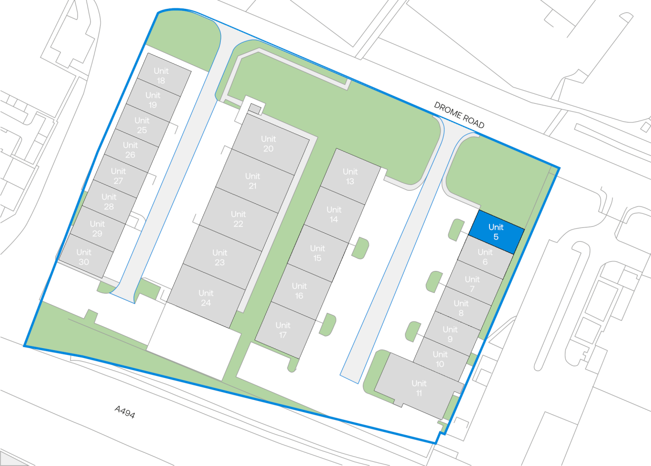 Site plan illustrating several units in grey inside a blue boundary; Unit 5 stands out in blue near Drome Road, with roads and green spaces encircling the site.