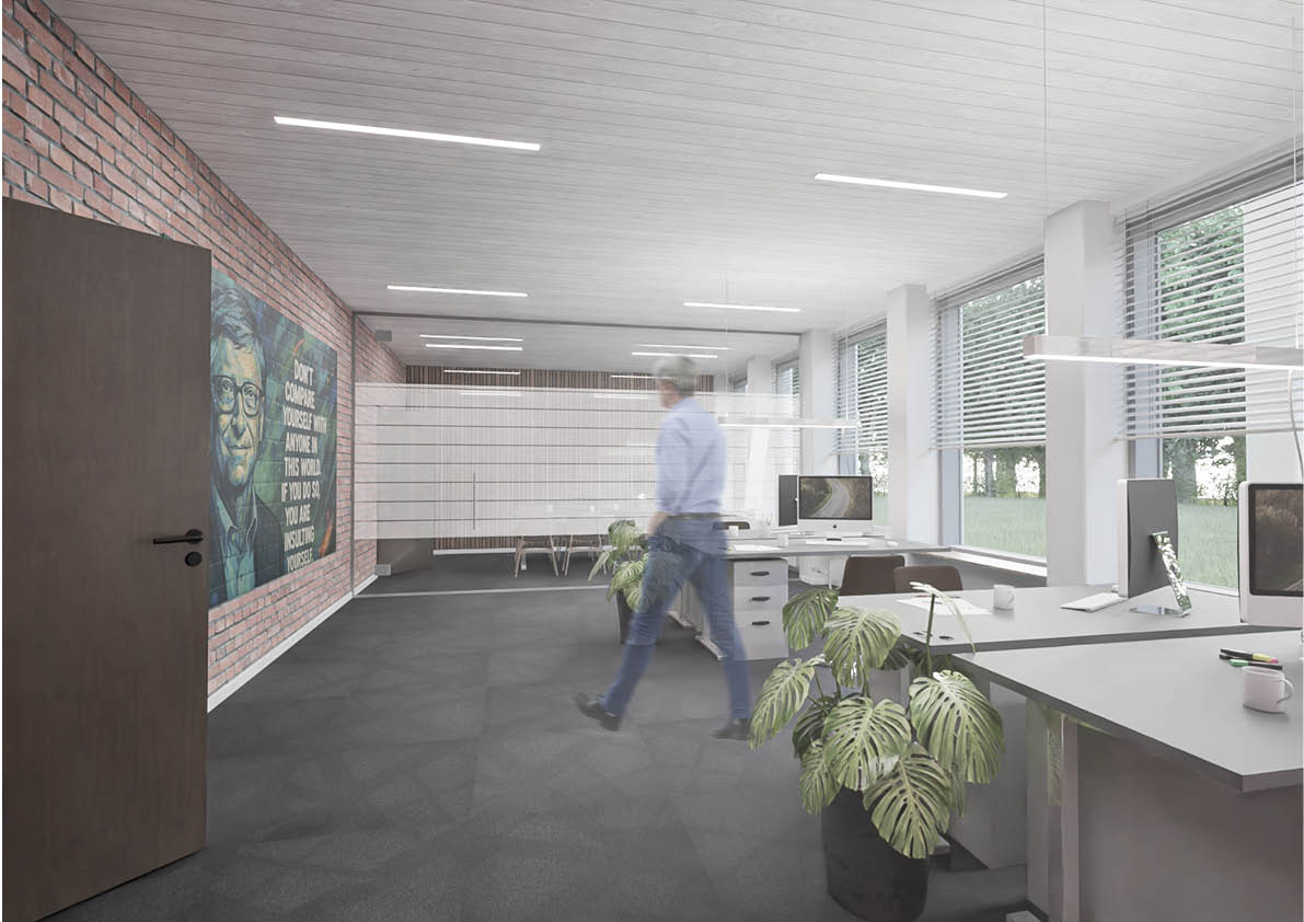 Moderne kontor med store vinduer, skriveborde, indendørs planter, en murstensvæg med et vægmaleri og et citat og en person, der går gennem rummet.