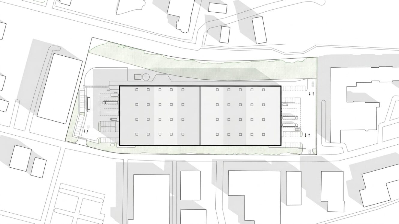 Lageplan, auf dem ein rechteckiges Gebäude, nahe gelegene Straßen, angrenzende Gebäude, Parkplätze und Grünflächen dargestellt sind.