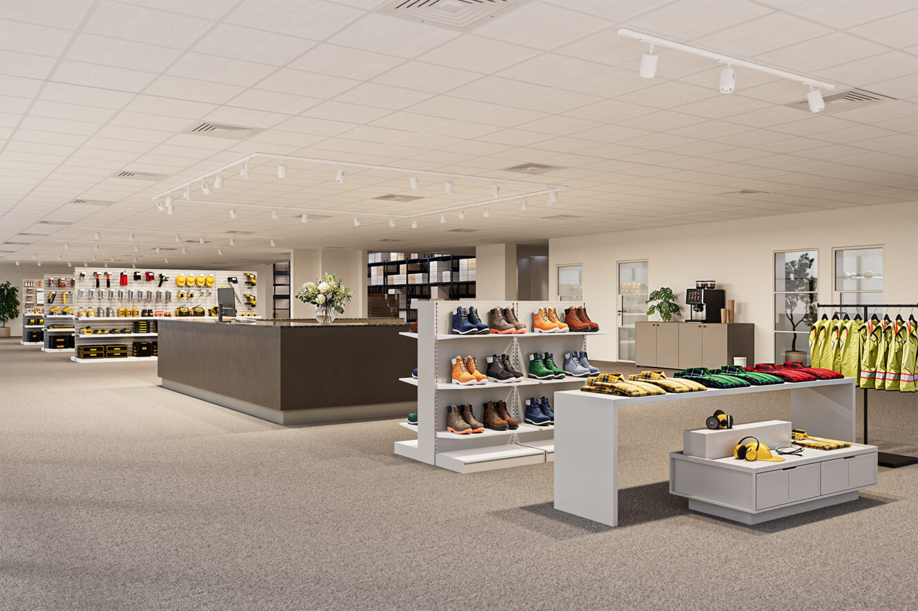 Rymlig butik med prydligt organiserade hyllor med arbetsskor, skyddshjälmar, kläder och accessoarer; väl upplyst med moderna armaturer och neutral inredning.