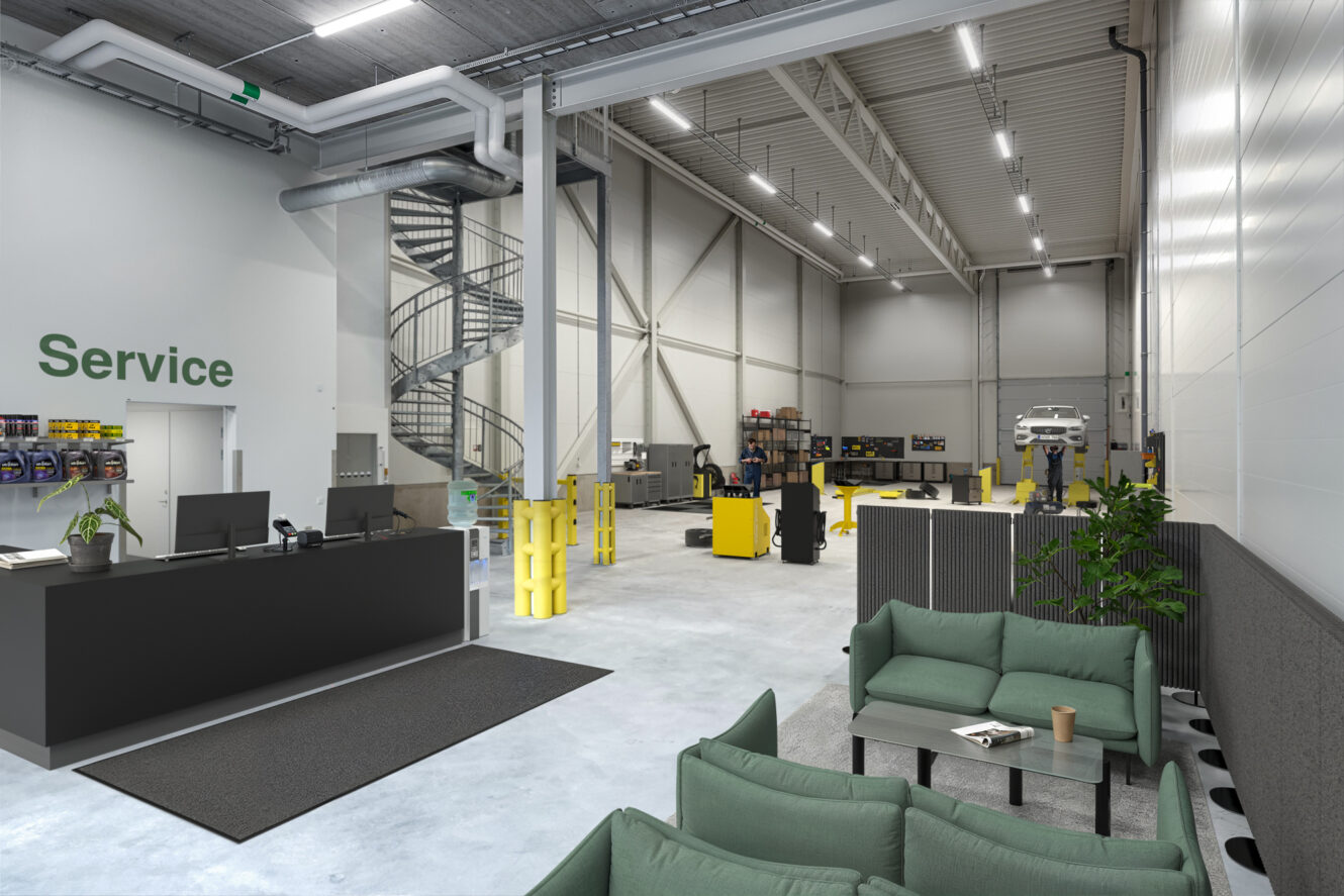 Modern inredning i bilverkstad med reception, väntrum med gröna soffor och öppen verkstad med utrustning och en bil på en hiss.