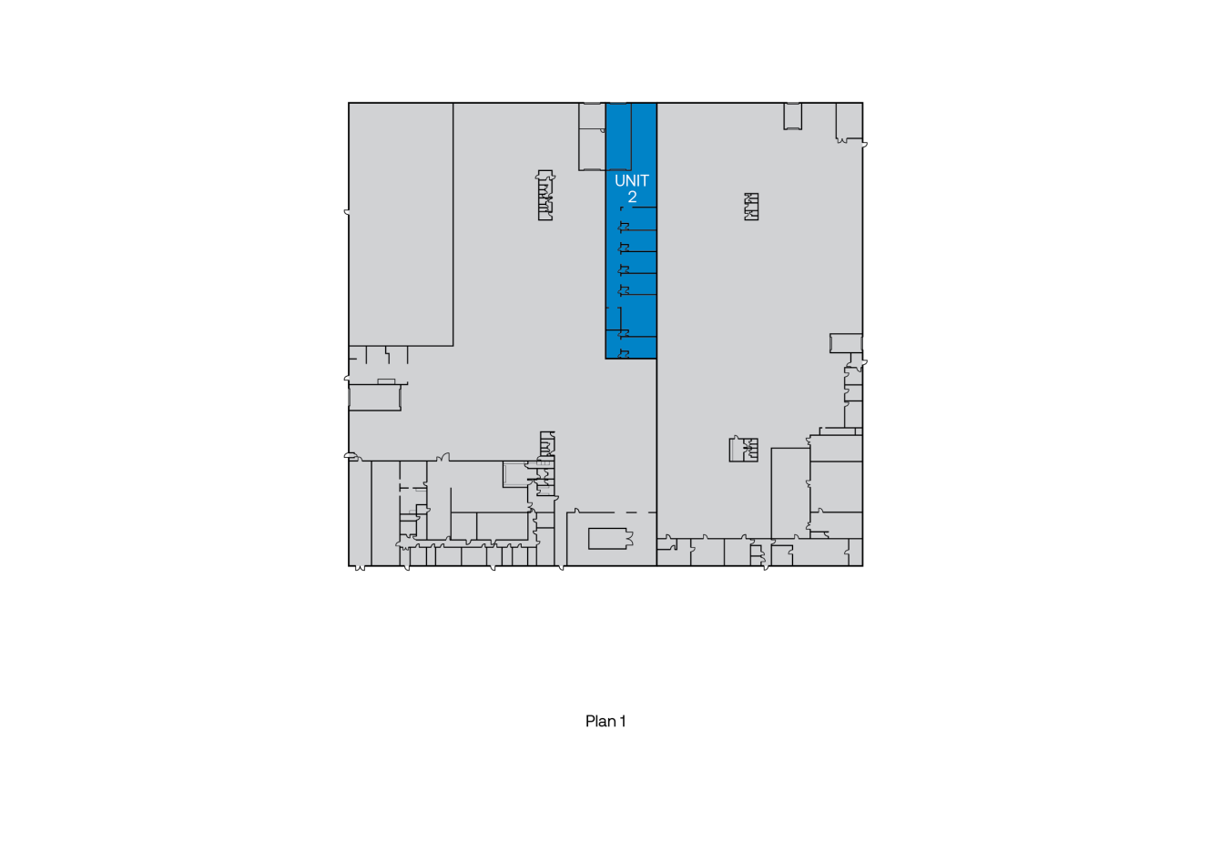 Planritning med enhet 2 markerad i blått, centralt placerad inom byggnadens kontur.