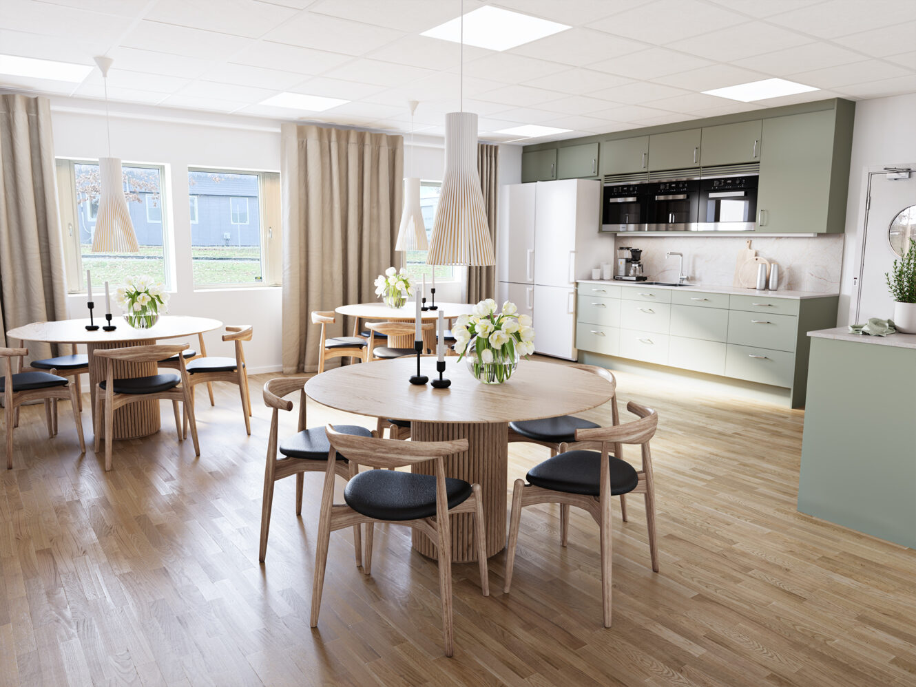 Modernt kök med ljusgröna skåp, runda träbord, svarta stolar, pendellampor och stora fönster som släpper in naturligt ljus.