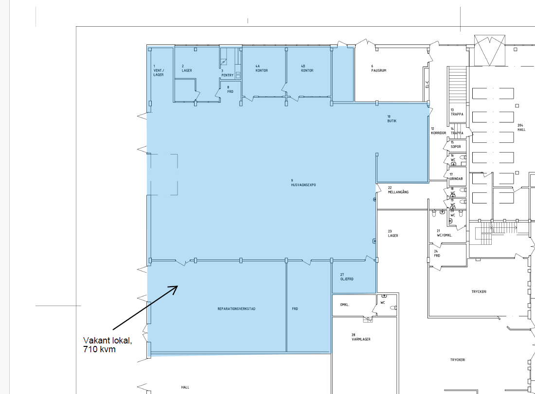 Planritning som markerar ett ledigt kommersiellt utrymme på 710 kvadratmeter i blått, med en pil och etikett som anger dess läge.